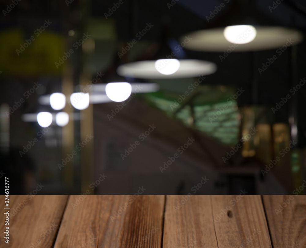 vintage wooden table on blurred cafe background dining room restaurant