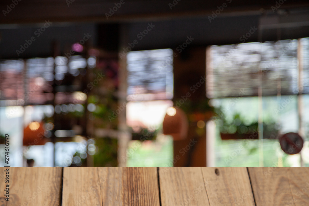 vintage wooden table on blurred cafe background dining room restaurant