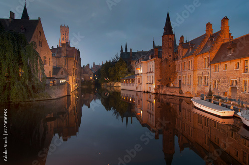 Europe, Belgium, Bruges, Belfry tower reflected in canal dusk
