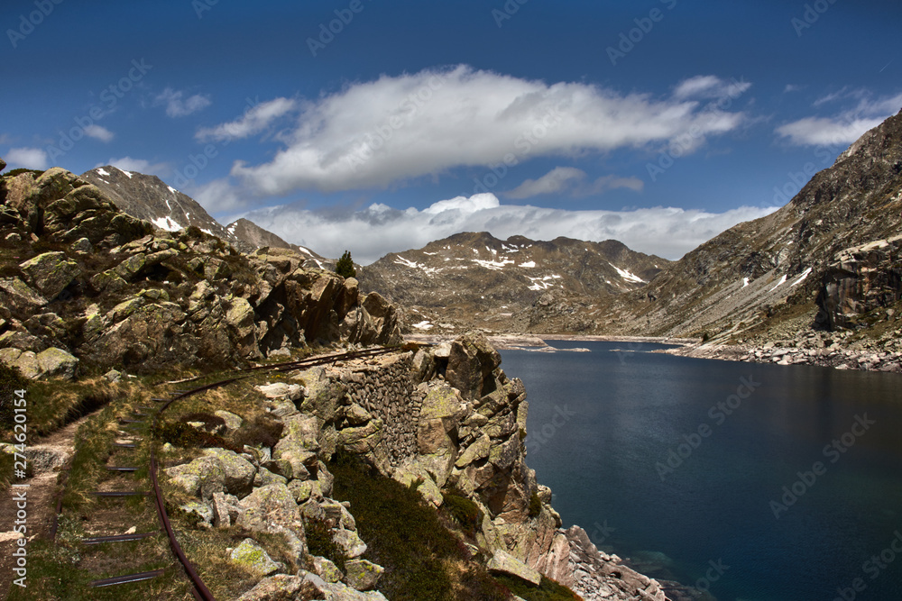  Pyrenean lake between rocky mountains