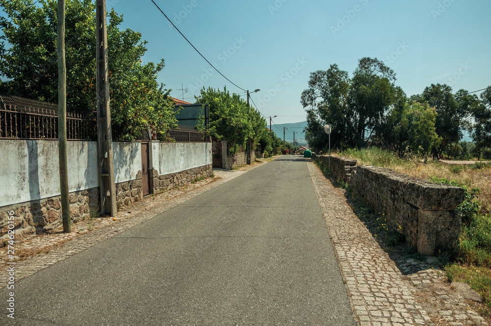 Countryside road next to small properties near Monsanto Countryside road next to small properties near Monsanto