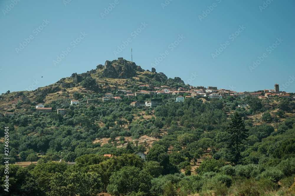 Hilly landscape with the small Monsanto village on top