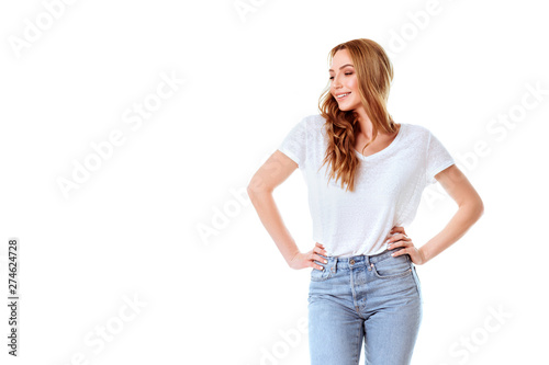 Portrait of emotive good-looking caucasian woman laughing while looking aside and standing against white background. © Margo Basarab