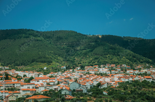 Countryside landscape with white houses on hill © Celli07