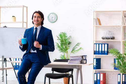 Young businessman sitting and working in the office