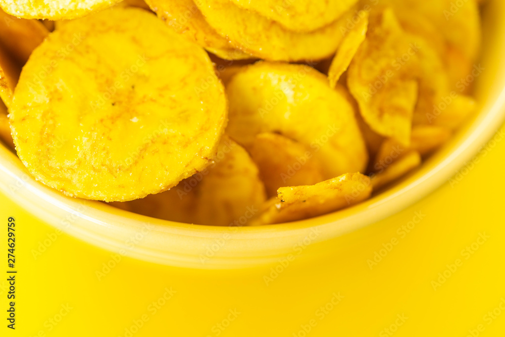 Baked Plantain Chips in Yellow bowl - a healthy snack
