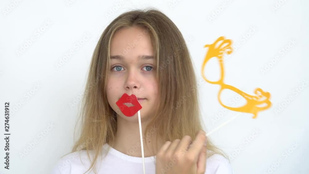 Portrait of a happy cute teenage girl with long flowing hair on a white background who is holding ..... Close up. Portrait of a happy cute teenage girl with long flowing hair on a white background who is holding ..... Close up.