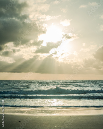 Sun Beams Shining Over the Ocean