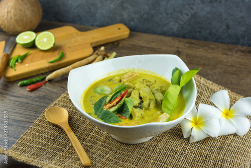 fish ball Green curry with coconut curry  (Kaeng kheiyw hwan) on dark wooden background with Thai tradition food served with steamed rice. Thai food very popular