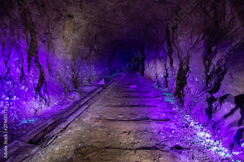 Abandoned uranium mine illuminated by ultraviolet light photo