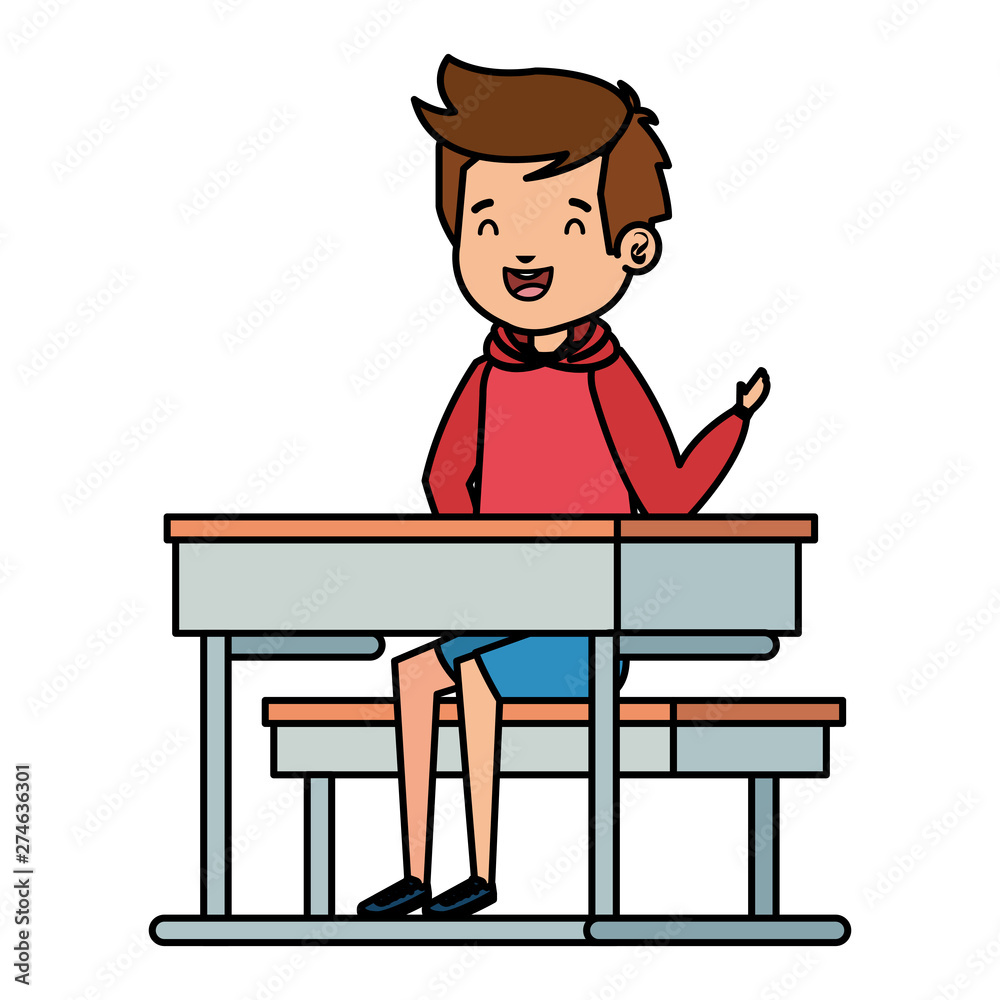 happy student boy seated in school desk
