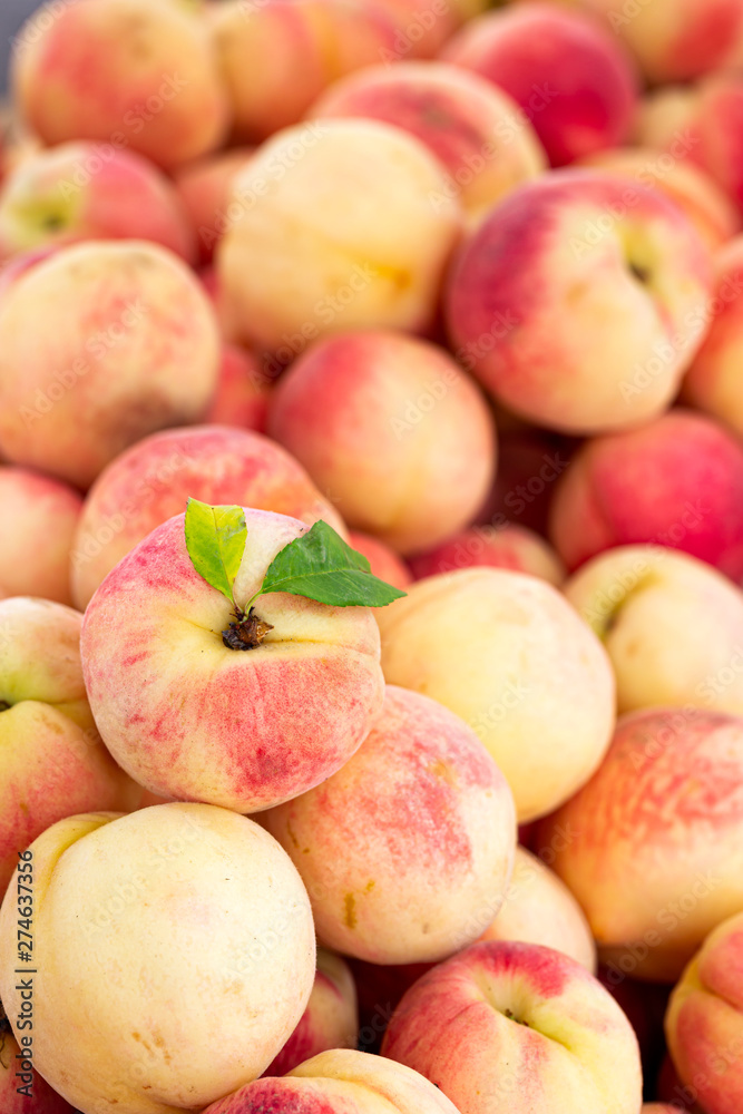 White peaches at an outdoor market