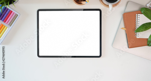 Office Desk workspace top view for present advertising product on tablet screen
