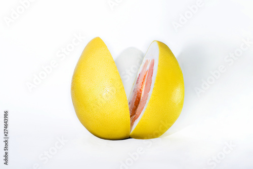 two halves of yellow Pamelo on white background photo