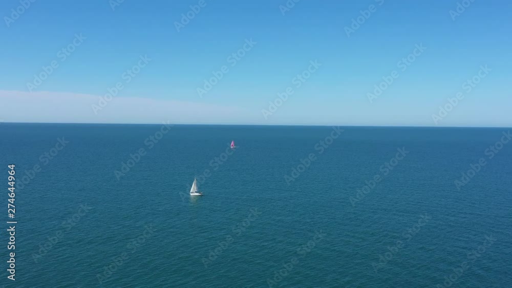 Sailing boats open sea aerial shot sunny day mediterranean shore France Sailing boats open sea aerial shot sunny day mediterranean shore France