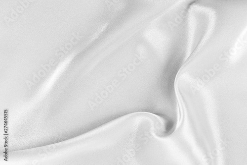 The texture of the satin fabric of white color for the background