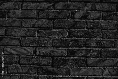 dark black and white background of old brick wall