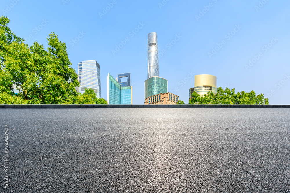 Shanghai city buildings and empty asphalt road Shanghai city buildings and empty asphalt road