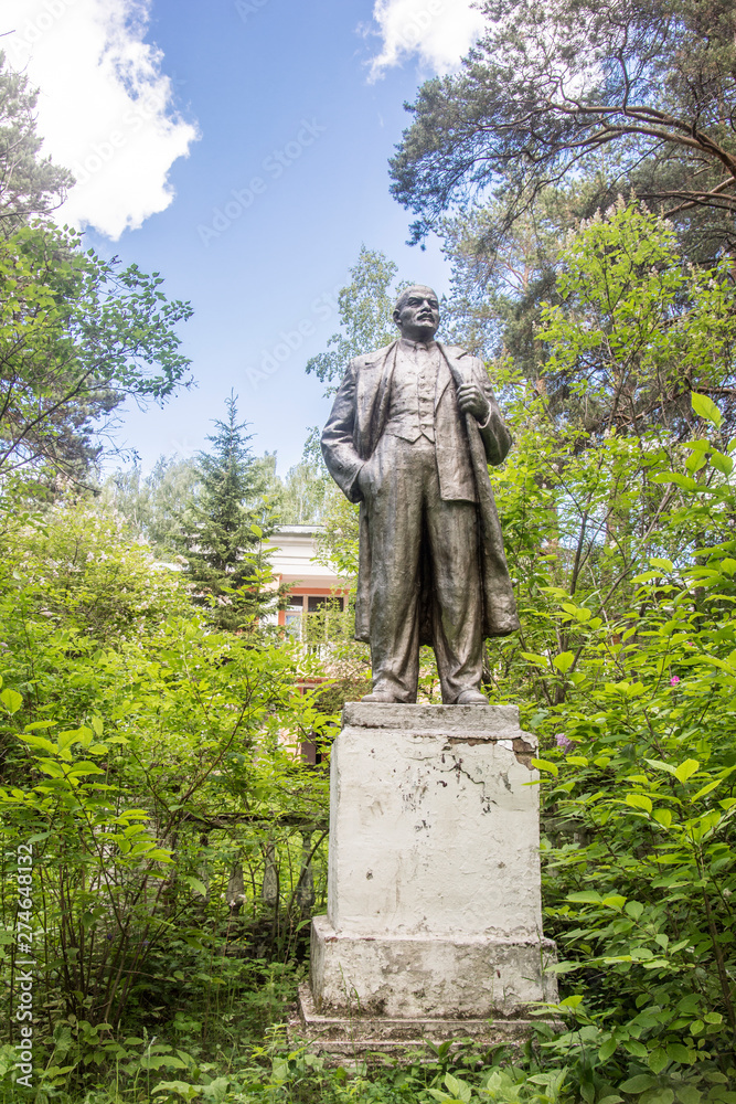 Russia.  Yekaterinburg.   Lenin sculpture in the summer pine forest .