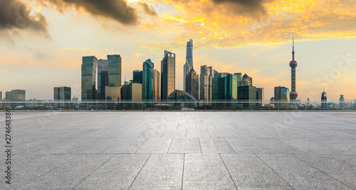 Panoramic skyline and buildings with empty concrete square floor in Shanghai