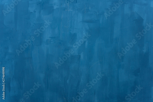 The texture of the blue wall. Artistic application of putty on the wall. Decorative wall in the photo studio