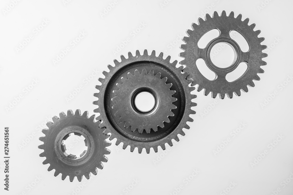 top view of 3 metal gear isolated on white top view of 3 metal gear isolated on white