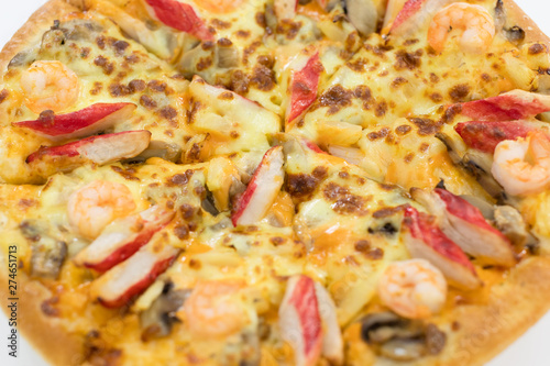 Seafood pizza on white background.