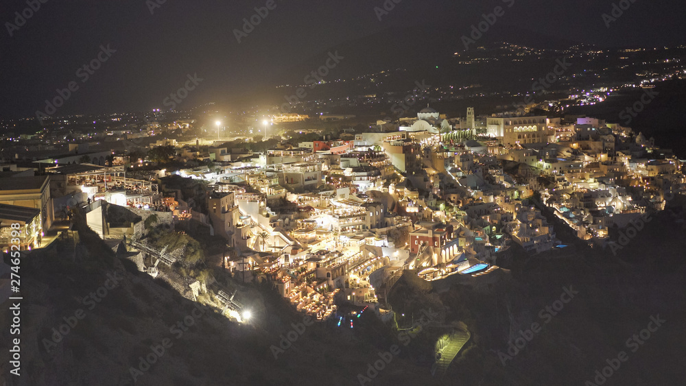 the town of fira at night on the island of santorini