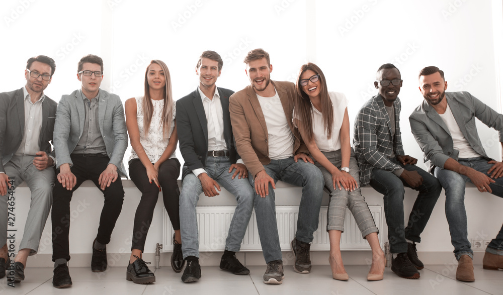 Obraz premium young people are waiting for an interview, sitting in the office lobby