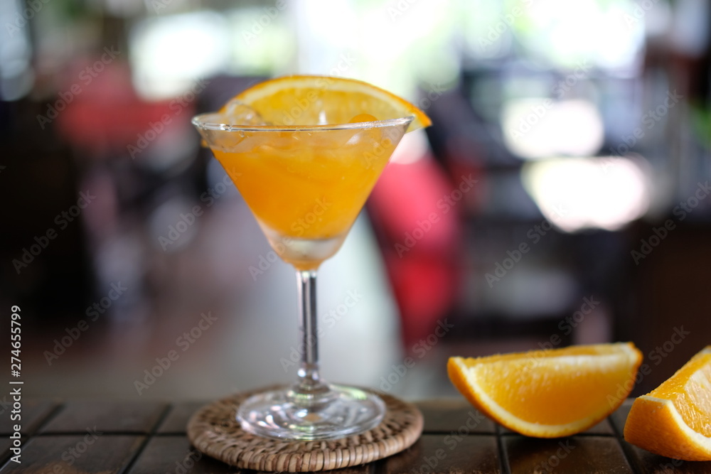 orange margarita cocktail on counter bar
