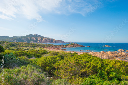 Rocky coast of the island of Sardinia in the Mediterranean Sea in sunlight in spring