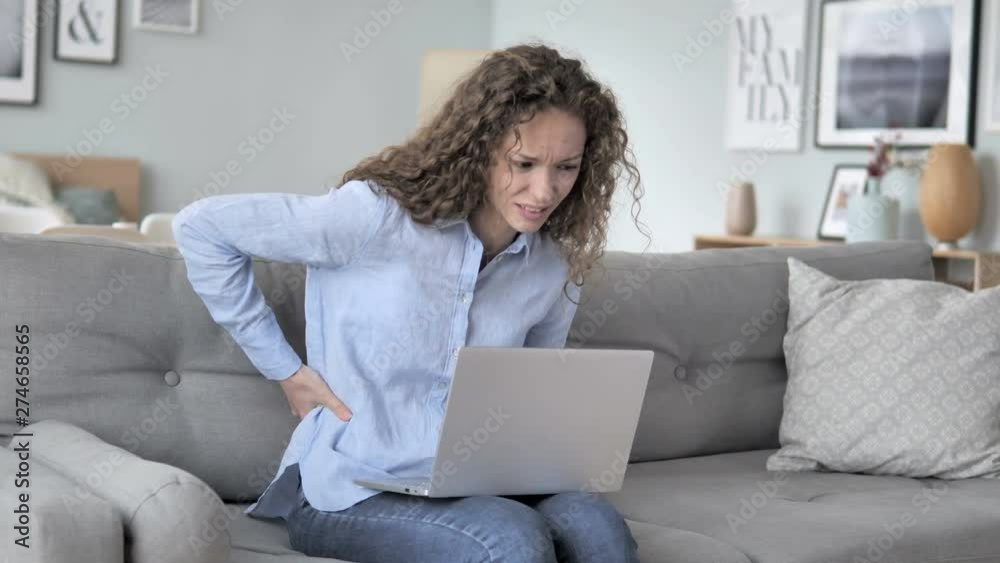 Spinal Back Pain while Curly Hair Woman Working in Creative Office Spinal Back Pain while Curly Hair Woman Working in Creative Office