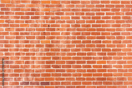 A wall of rustic masonry bricks on a building