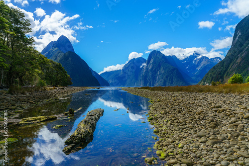 reflections of mountains in the water, milford sound, new zealand 44