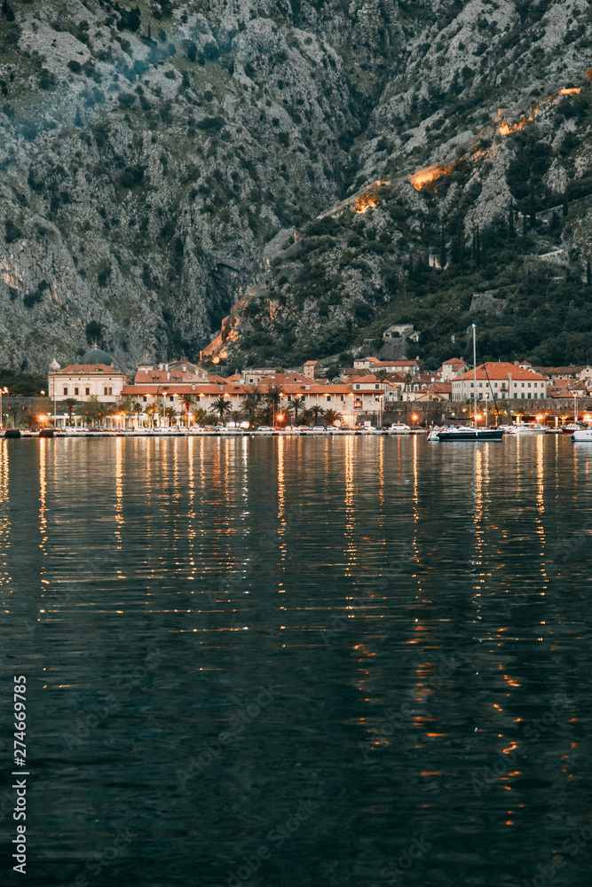 Panoramas of the night city and fortress. Evening Bay of Kotor, Montenegro.