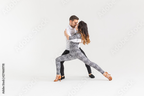Salsa, kizomba and bachata dancers on white background with copy space. Social dance concept