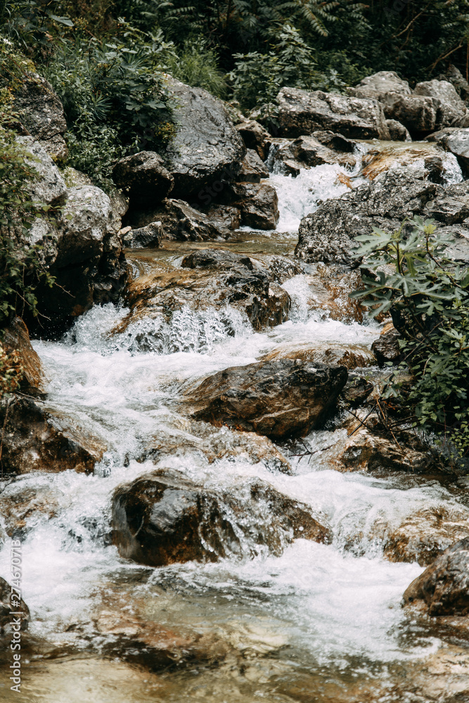 Atmospheric nature and mountain river. Beautiful mountain waterfall in Montenegro. Atmospheric nature and mountain river. Beautiful mountain waterfall in Montenegro.