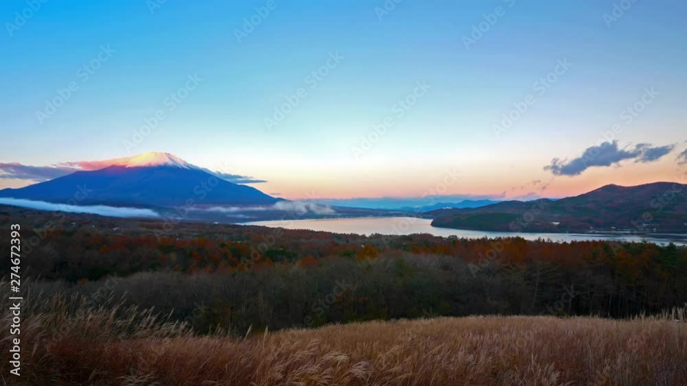 Time-lapse from a plain with moving clouds and Mount Fuji in the background Time-lapse from a plain with moving clouds and Mount Fuji in the background