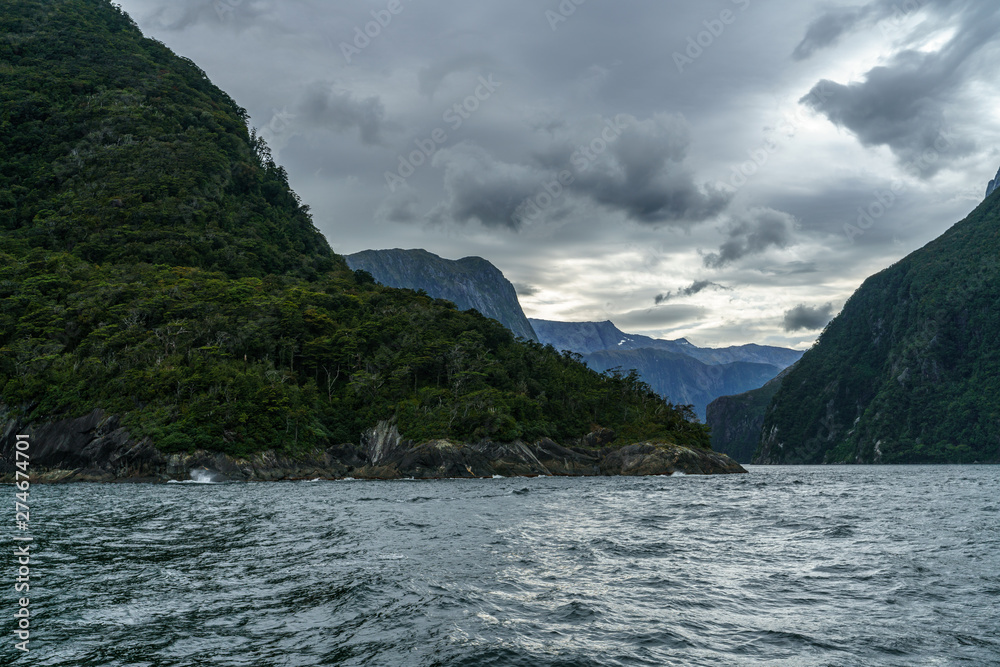 steep coast in the mountains at milford sound, fjordland, new zealand 21