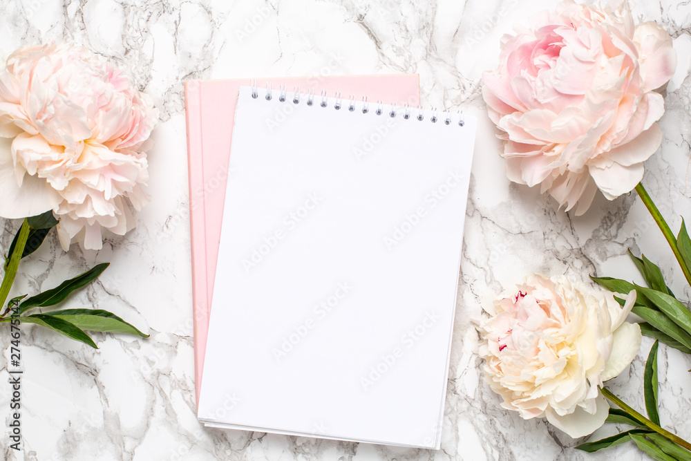 Beautiful white peony flower and notebook on marble background - obrazy, fototapety, plakaty 