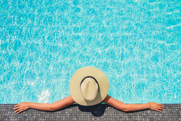 Carefree woman relaxation in swimming pool summer Holiday concept