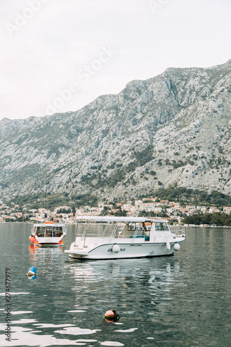 Landscapes and sea in Montenegro, fishing. Fishing boat rocking on the waves.