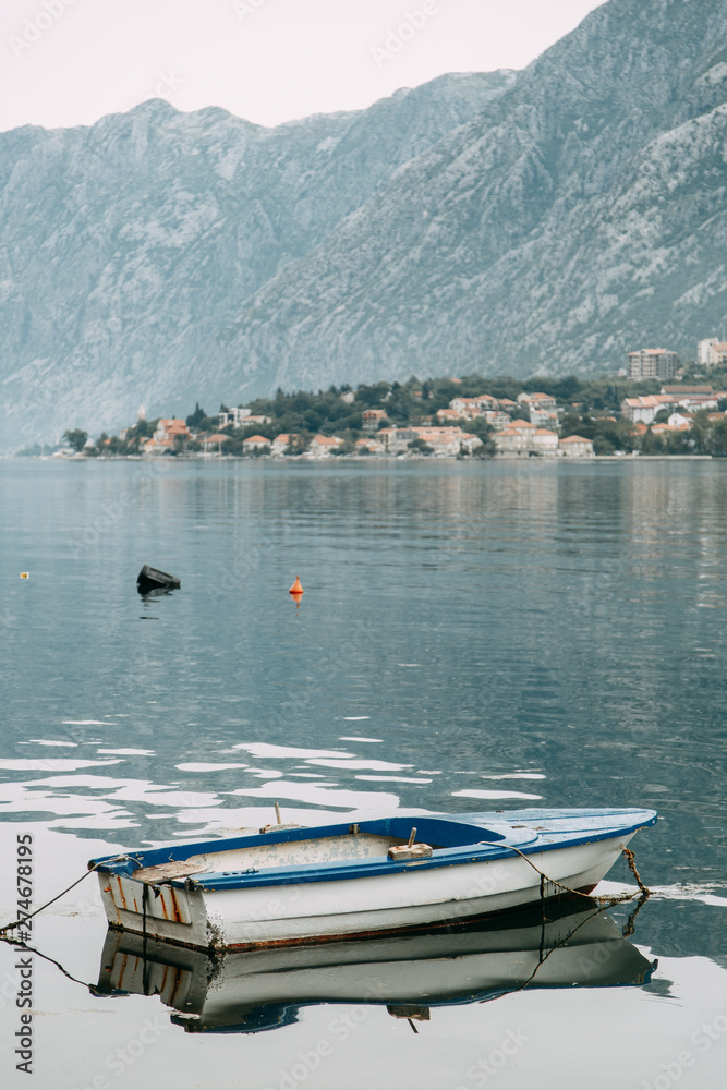 Landscapes and sea in Montenegro, fishing. Fishing boat rocking on the waves.