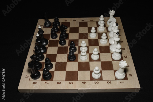 Chessboard with black chessmen as a skill backdrop