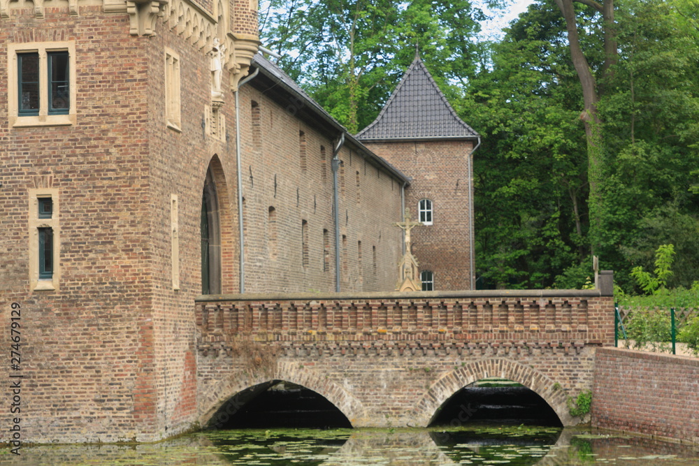 Moated castle with an old bridge
