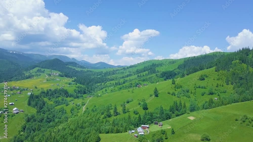 Drone flying above mountain village Drone flying above mountain village