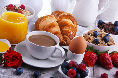 Breakfast served with coffee, juice, croissants and fruits