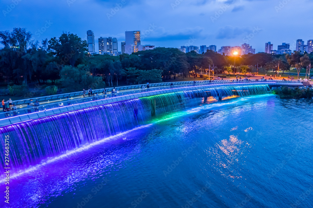 Fototapeta premium The Anh Sao (Starlight) Bridge is located in the heart of the international commercial and financial district of Phu My Hung. It is the first modern pedestrian bridge of Ho Chi Minh City in Vietnam