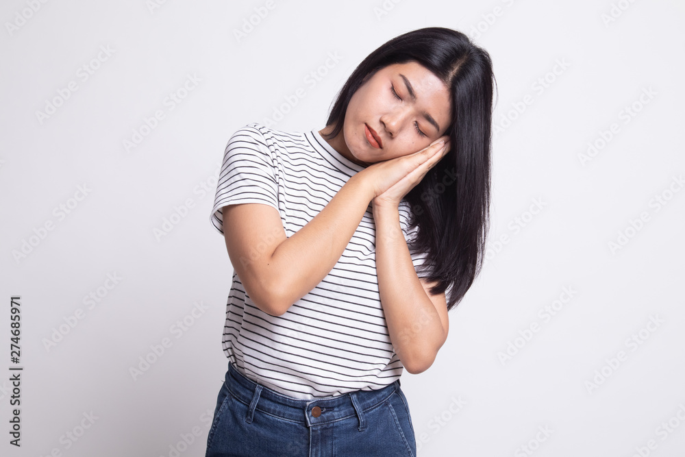 Beautiful young Asian woman with sleeping gesture. Beautiful young Asian woman with sleeping gesture.