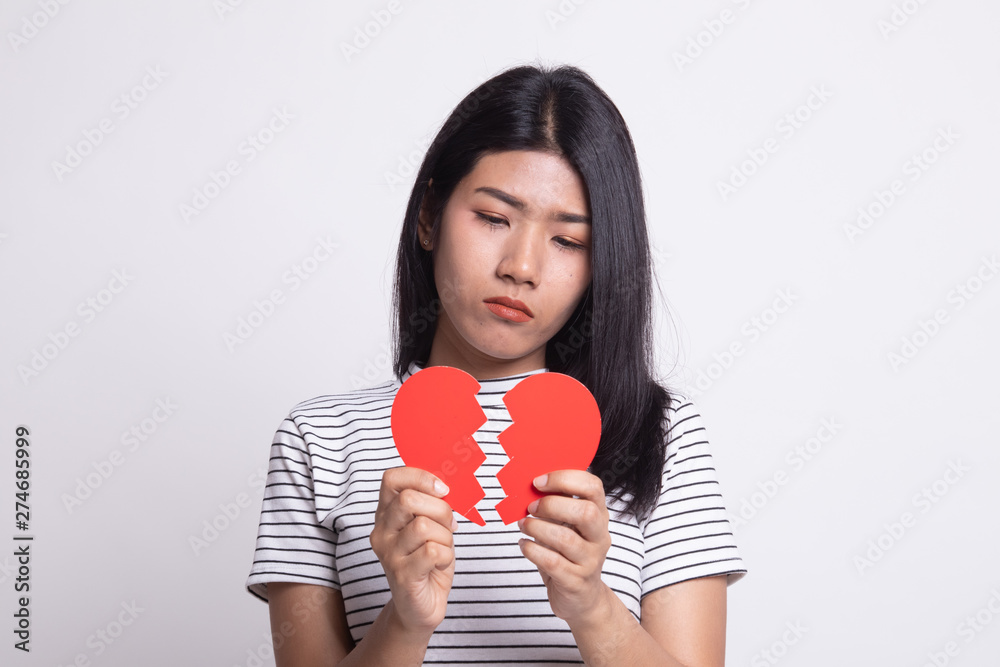 Beautiful young Asian woman with broken heart. Beautiful young Asian woman with broken heart.